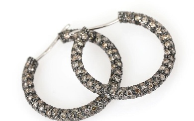 A pair of diamond ear pendants each set with numerous brilliant-cut champagne...