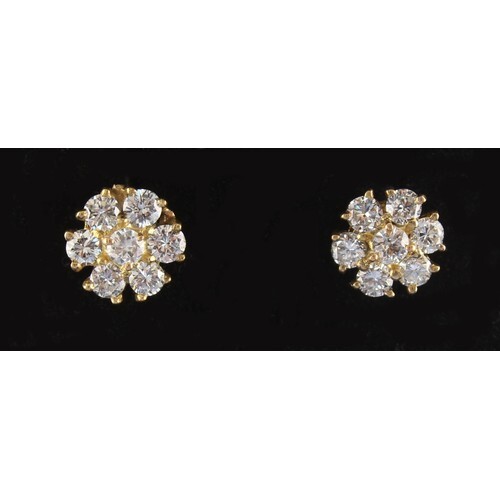 A pair of diamond flowerhead cluster earrings, with post & b...