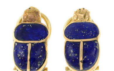 A pair of lapis lazuli earrings, each designed to depict a scarab beetle.
