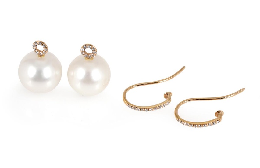 A pair of pearl and diamond ear pendants each set with numerous...