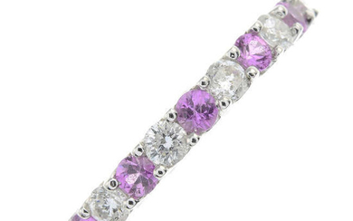 A pink sapphire and brilliant-cut diamond full eternity ring.