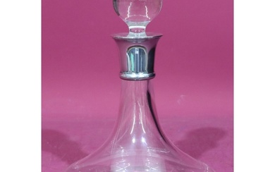 A plain glass round ship's decanter with stopper and London ...
