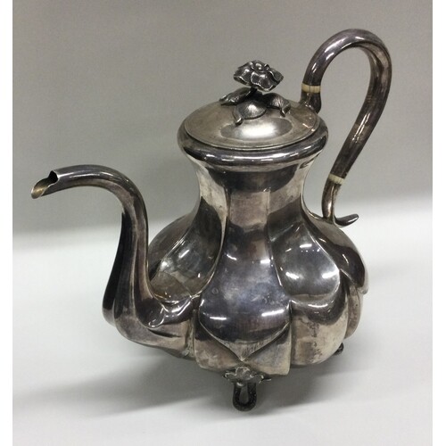 A rare Russian silver coffee pot of panelled design with aco...