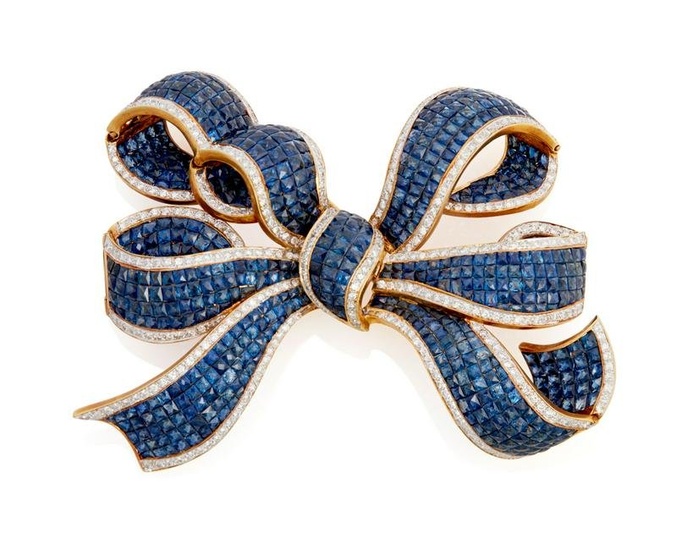 A sapphire and diamond bow brooch