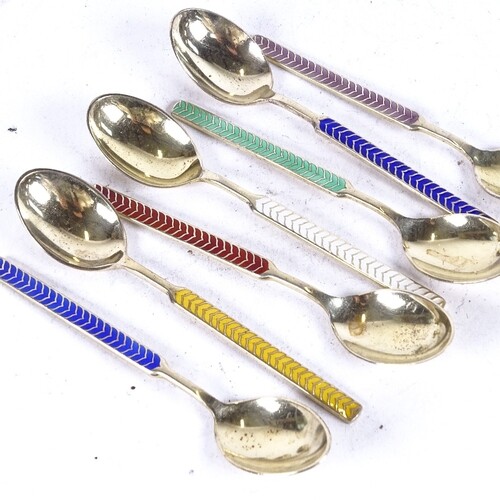 A set of 7 sterling silver and coloured enamel teaspoons, by...