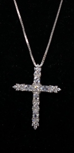 A sterling silver and white crystal studded crucifix pendant...