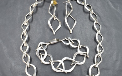 A suite of silver jewellery stamped TM-60 of linked open leaf form with box clasps, comprising