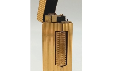 A vintage, gold plated DUNHILL lighter, hight: 6. 4 cm, weig...