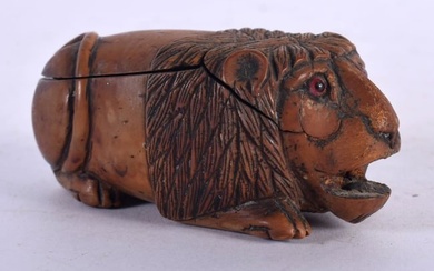 AN 18TH CENTURY FRENCH DUTCH FRUITWOOD CARVED WOOD SNUFF BOX modelled in the form of a recumbent lio