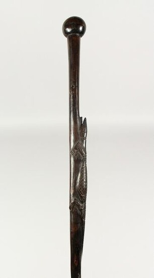 AN AFRICAN HANDLE WALKING CANE carved with an alligator