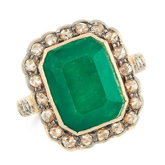 AN EMERALD AND DIAMOND CLUSTER RING set with an emerald