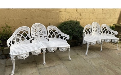 AN EXCELLENT PAIR OF CAST IRON THREE SEATER GARDEN SEATS, bo...