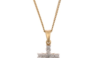 An 18ct gold diamond cross pendant necklace, on 9ct fine cur...