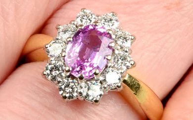An 18ct gold pink sapphire and brilliant-cut diamond cluster ring.