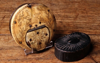 An 18th Century Horn Snuff Box of flat, circular form. The top engraved with two cocks flanked by s