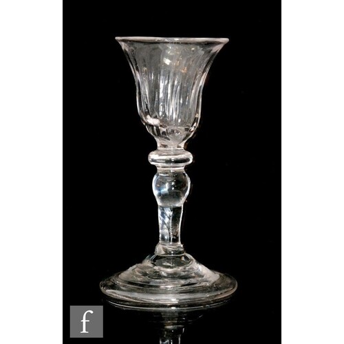 An 18th Century balustroid gin glass circa 1740, the fluted ...