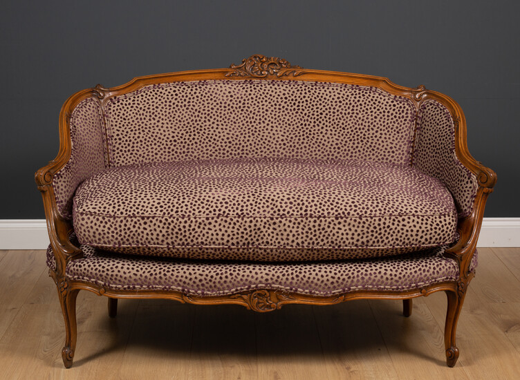An 18th century French style walnut small sofa