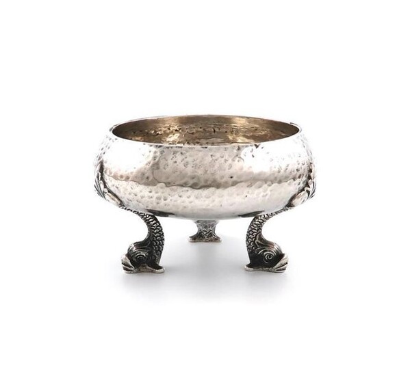 An Edwardian Scottish silver bowl, by Hamilton and Inches, Edinburgh 1906, circular form, spot-hammered decoration, on three mythical dolphin feet, height 7cm, approx. weight 5.7oz.