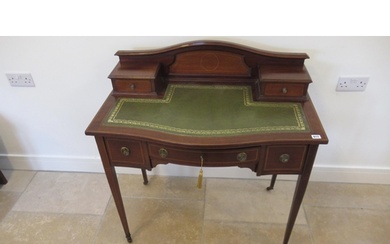 An Edwardian mahogany and inlaid bow fronted ladies writing ...