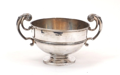 An Edwardian silver Walker & Hall centrepiece bowl, Sheffield, c.1902, the circular body raised on a round foot and designed with bifurcated scroll handles to either side, bowl 18.1cm dia., 26.3cm wide, 14.5cm high (to handles), approx. weight 17.2oz