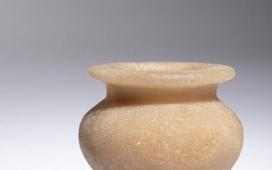 An Egyptian Alabaster Cosmetic Jar Height 2 1/8 inches.