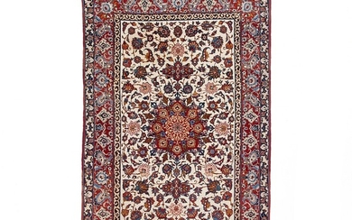An Isfahan rug, Persia. Medallion design. C. 1 mio. kn. pr. sqm. Knotted with kork wool on silk warps. C. 1960. 162×105 cm.