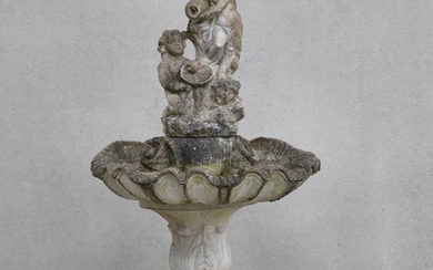 An artificial stone water fountain. Ca. 1930. H. 170 cm. W. 92 cm. D. 95 cm.