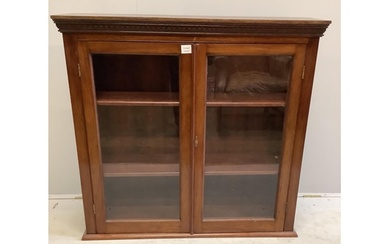 An early 20th century glazed mahogany bookcase, width 107cm,...