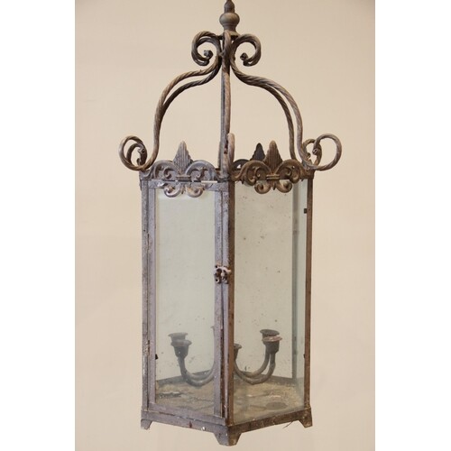 An early 20th century hexagonal wrought iron hanging candle ...