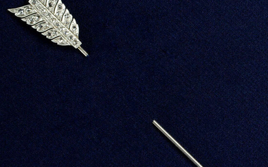 An early 20th century platinum and gold, rose-cut diamond arrow jabot pin.