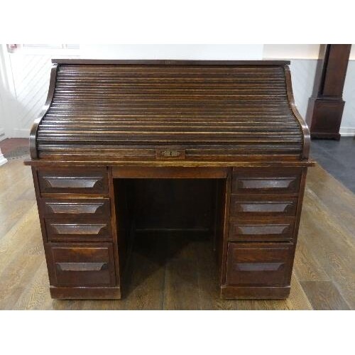 An early 20thC American oak roll top Desk, marked 'Cutler', ...