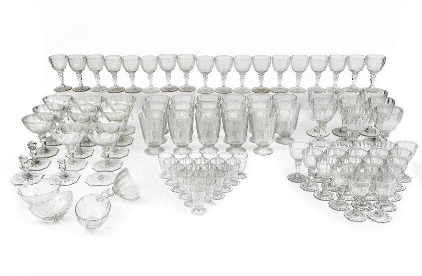 An etched crystal part stemware service, by J & L Lobmeyr, Austria, late 19th/early 20th century, each finely engraved with foliate scrollwork and trellis design on faceted stems, comprising: seventeen water goblets, eight red wine stems, eighteen...