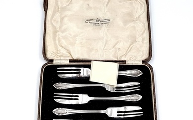 An interesting set of six sterling silver pastry forks with ...
