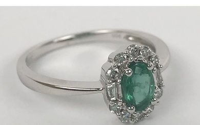 An oval cut emerald ring, with RBC and baguette cut diamonds...