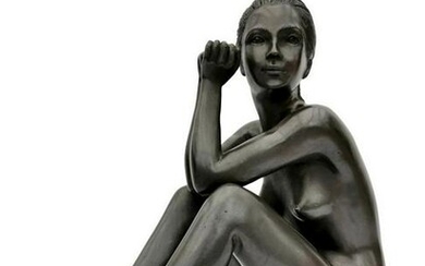 Bronze sculpture of a sitting woman