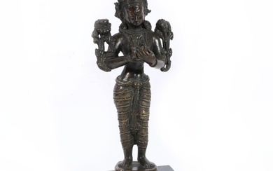 Bronze standing figure of the Hindu goddess Lakshmi raised on lotus base and attached on marble