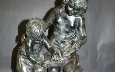 Bronze statue of 2 children reading