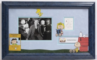 CHARLES SCHULZ SIGNED SNOOPY CARTOON with a photograph of...