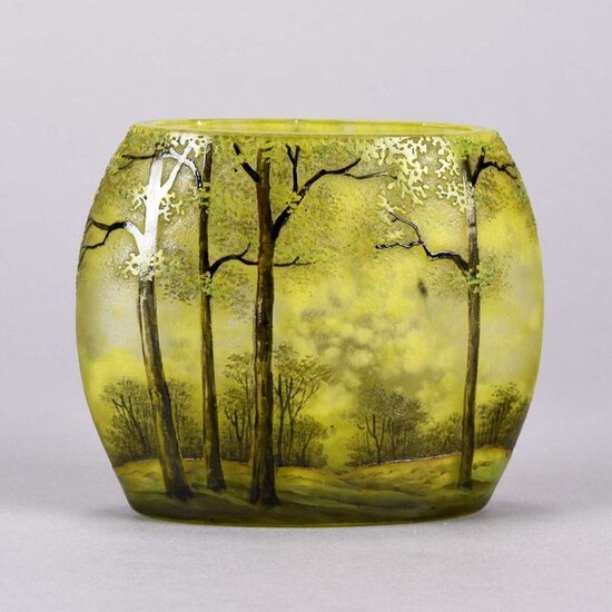 Daum Frères (late 19th Century) French Art Nouveau etched and enamelled cameo glass vase. Japanese influenced pillow shaped vase decorated with a deep green springtime wooded landscape. Signed to base Daum Frères and with Cross of Lorraine. Circa 1900...