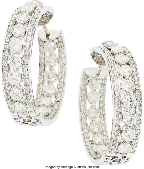 Diamond, White Gold Earrings The hoop earrings feature full-cut...