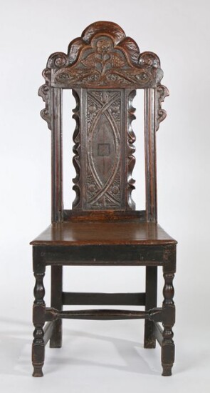 Early 18th Century oak side chair, circa 1700, the arched top rail above a flower and inlaid panel