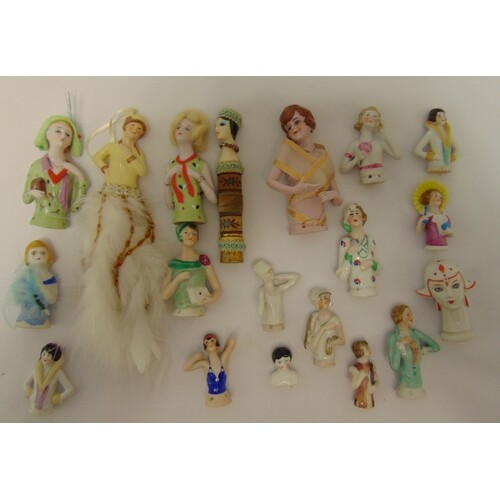 Eighteen ceramic half dolls of varying size and style