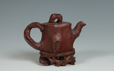 FIVE PIECES CHINESE POTTERY. Including miniature brown ceramic teapot, modeled...
