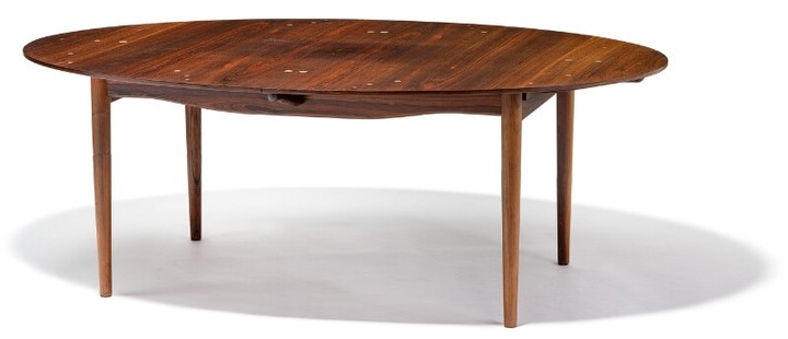 Finn Juhl: “Judas Table”. Oval Brazilian rosewood dining table with extension and two extra leaves. Top and leaves with circular silver inlays.