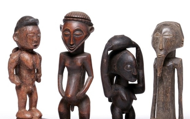 Four ancestor figures of carved patinated wood, one with reddish and black paint. Hemba style. H. 29–37 cm. (4)