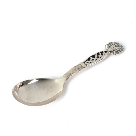 Georg Jensen: Large silver serving spoon with openwork handle. Handle's upper part with stylize flower. L. 24 cm.