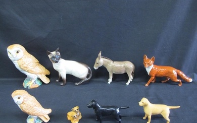 Group of eight Beswick animal figures to include: owls, fox,...