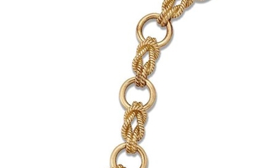 Hermes, a gold bracelet, by Hermes, of rope work and annular links, signed Hermes, numbered, French assay and maker's marks, British import marks for 18-carat gold, length 18cm.