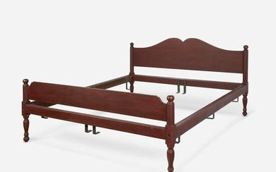 Large red-painted bed, likely 20th century