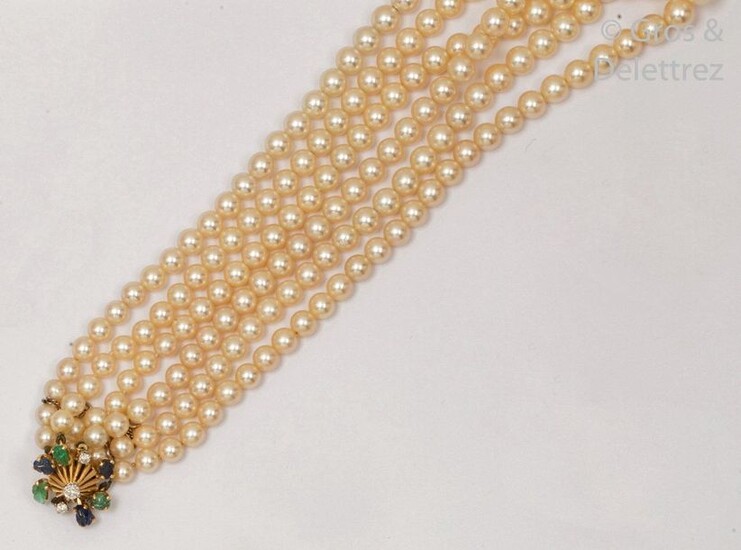 Necklace composed of three rows of cultured pearls....